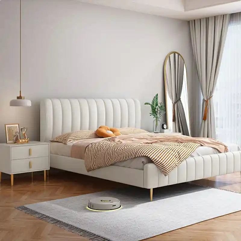 Celan cream upholstered with gold legs and channel tufting; Celan upholstered bed shown as a platform bed.