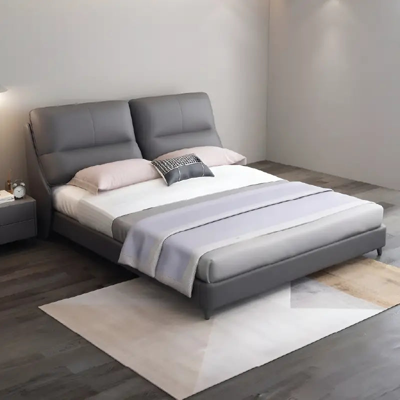 King size upholstered bed featuring a dual-panel headboard with horizontal stitch detailing, soft padded upholstery and contemporary modern bed frame design