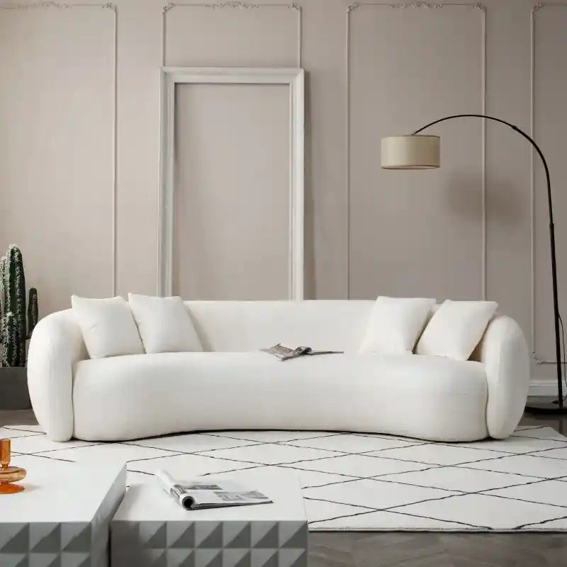 Curved kidney-shaped sofa with plush cushions, fabric sofa, stylish sofa design