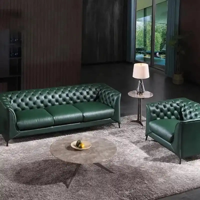 classic dark faux leather sofa with deep button details, high back and broad supportive arms — side angle showing the arms...