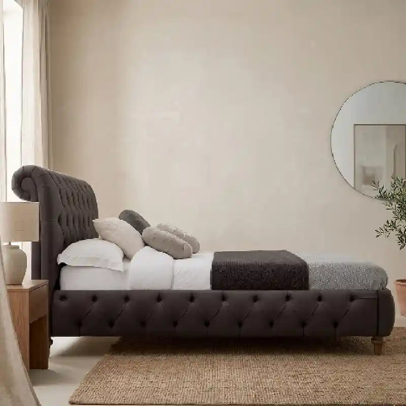Huxon luxury padded dark grey fabric upholstered bed; Huxon luxury bed shown as a bed with headboard.