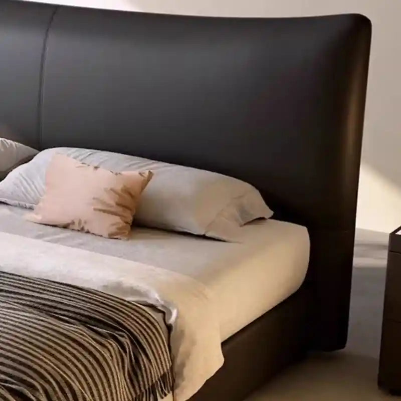 Kalman close-up of stitched headboard panel; Kalman bed with headboard shown as a luxury bed.