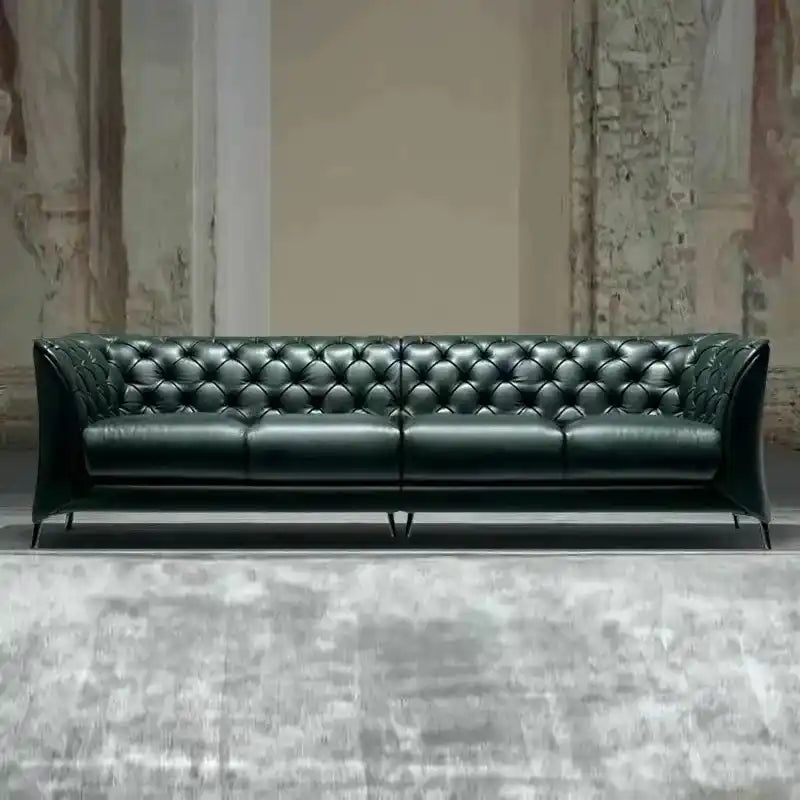 classic dark faux leather sofa with deep button details, high back and broad supportive arms — front angle showing the bac...