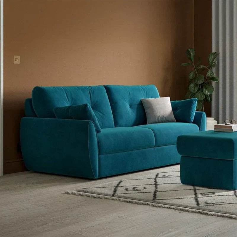 Pull-out sofa bed with tufted backrest, visible metal support frame, quilted mattress surface, rounded armrests, and compact sleeper sofa comfort